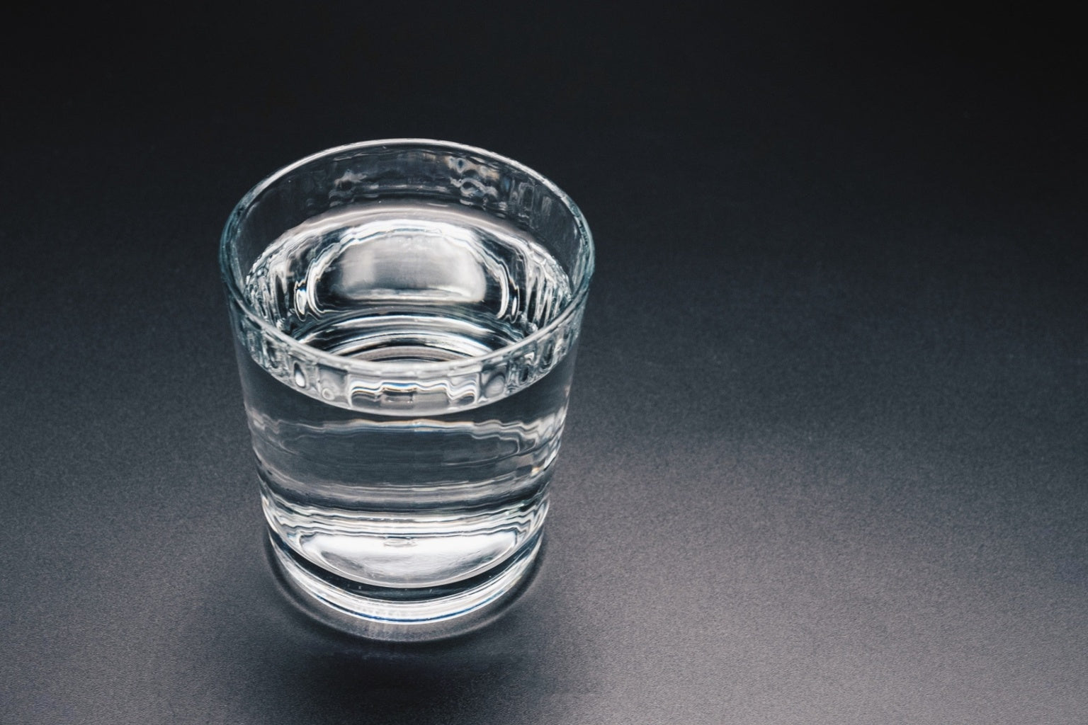 Clear glass of water representing alkaline water concept and clean hydration