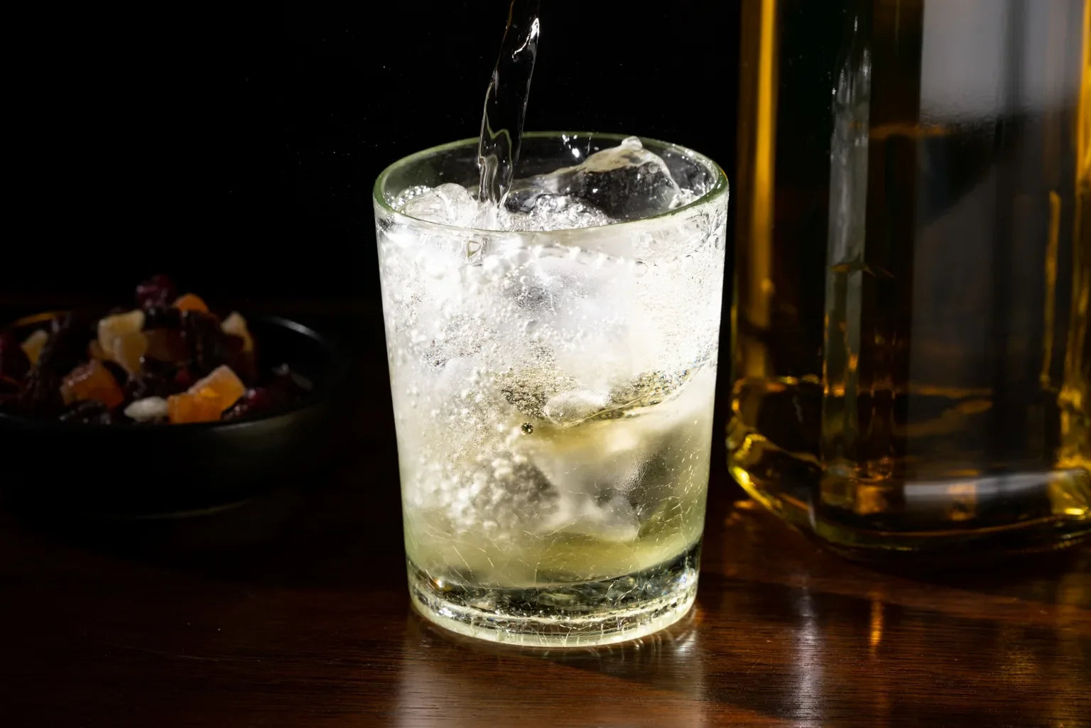 Cold Japanese highball with ice and bubbles, emphasizing refreshing soft water quality.