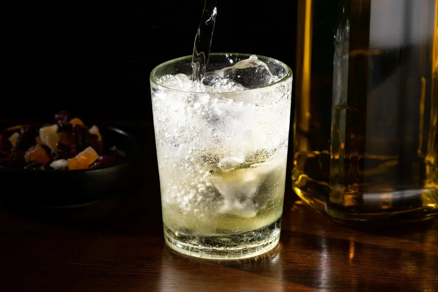Cold Japanese highball with ice and bubbles, emphasizing refreshing soft water quality.