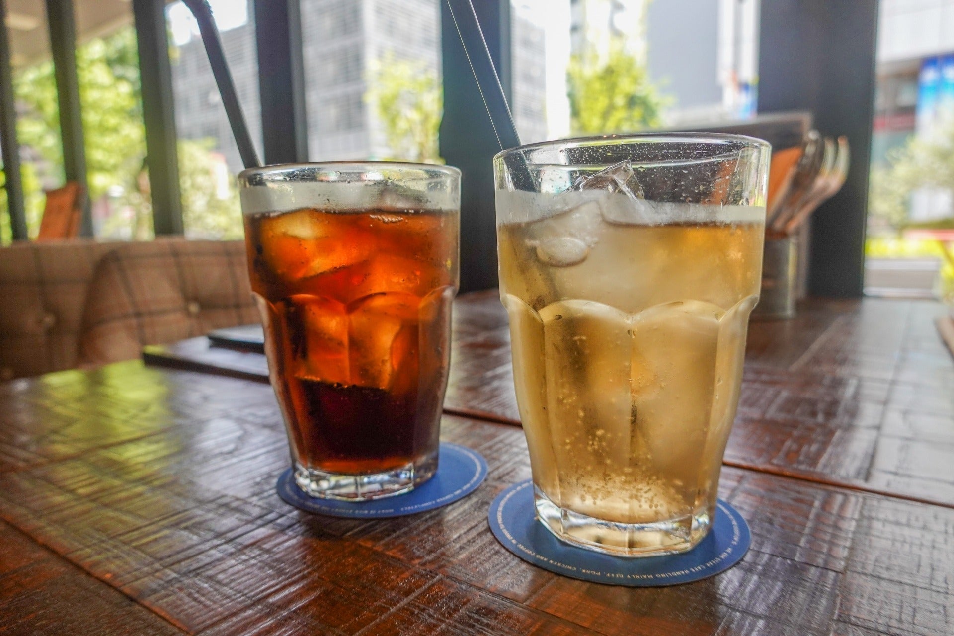 Iced coffee and iced sparkling drink served with ice cubes, showing how ice made from high-quality water can influence flavor and drinking experience.