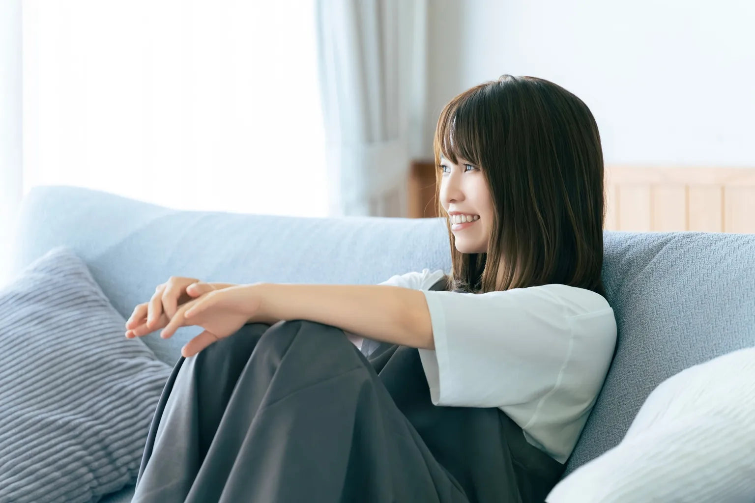 Japanese woman enjoying a comfortable new lifestyle with ONSENSUI99 in Thailand