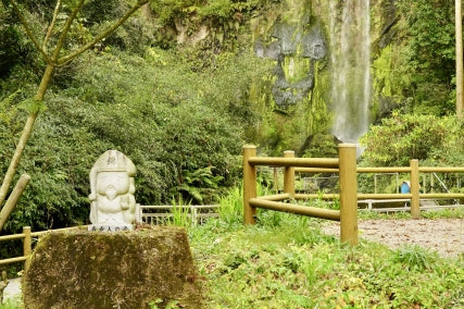 Waterfall and forest in Kinko Town, Kagoshima — a serene landscape symbolizing harmony between nature and the spirit of Japan’s wellness culture.