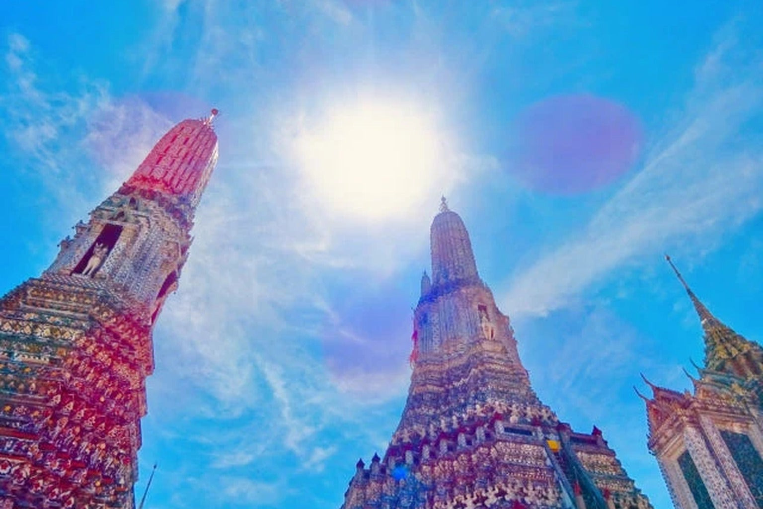 Thai temple under bright sun representing hot tropical climate lifestyle
