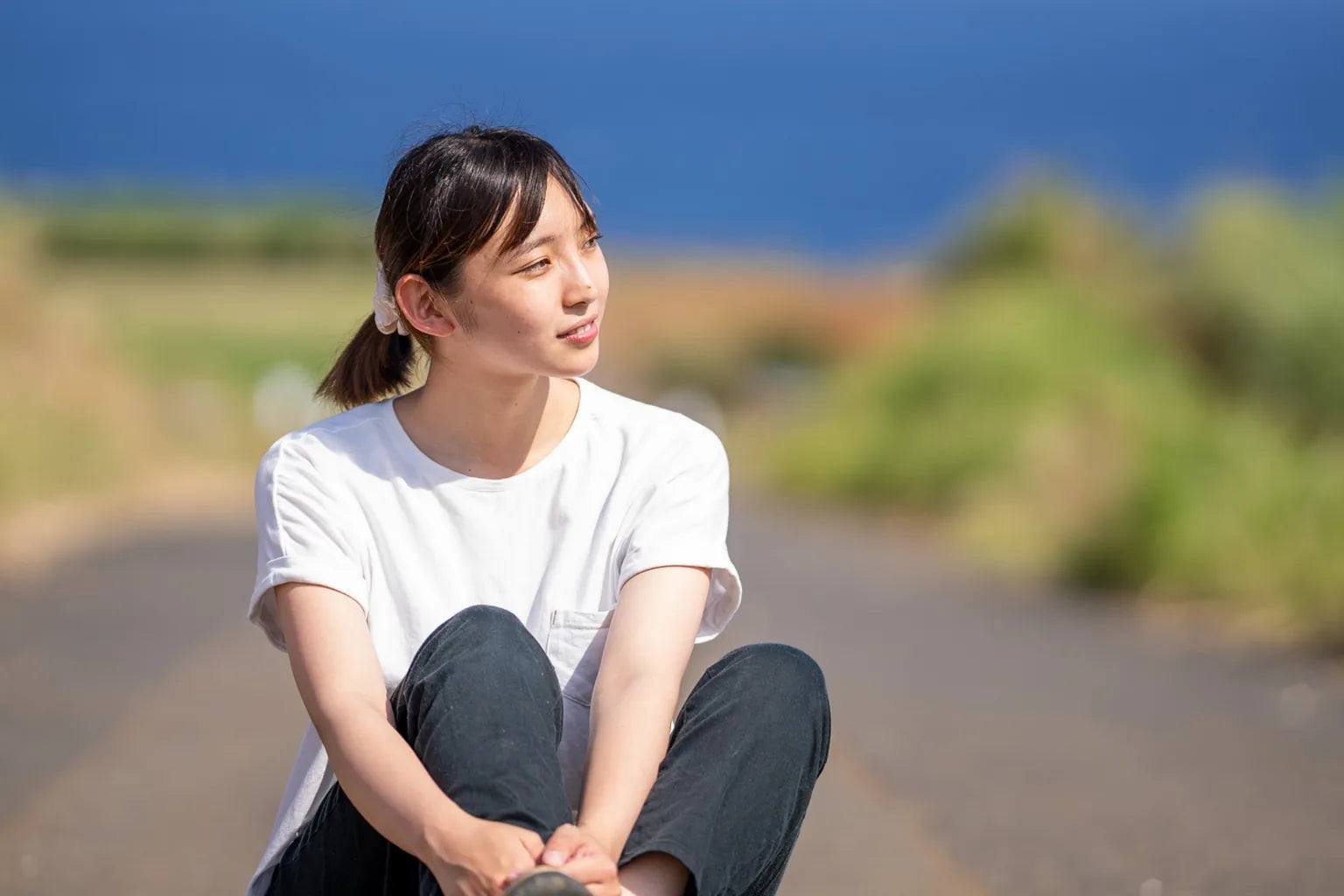 Young woman relaxing in nature during a wellness journey in Kagoshima Japan