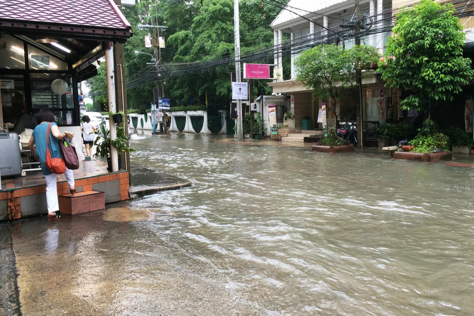 Bangkok flooded residential street during rainy season daytime Thailand