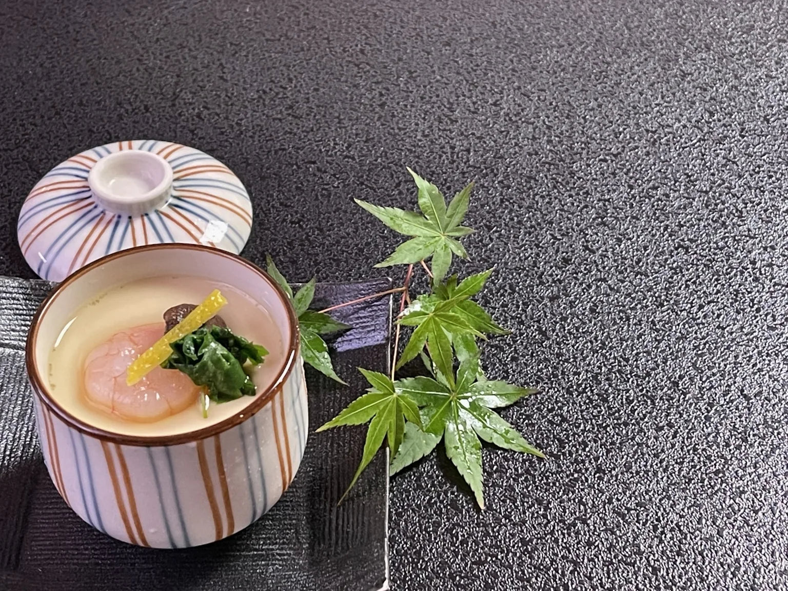 Japanese chawanmushi with scallop, seaweed and yuzu garnish