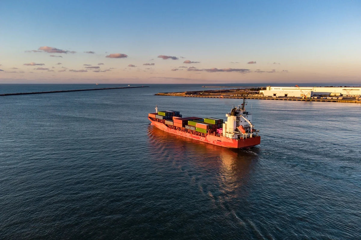 Container ship being loaded at a Japanese port for international export