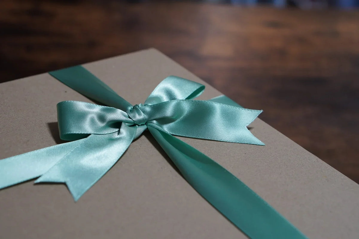 A ribbon-wrapped gift box representing a thoughtful present for someone special.