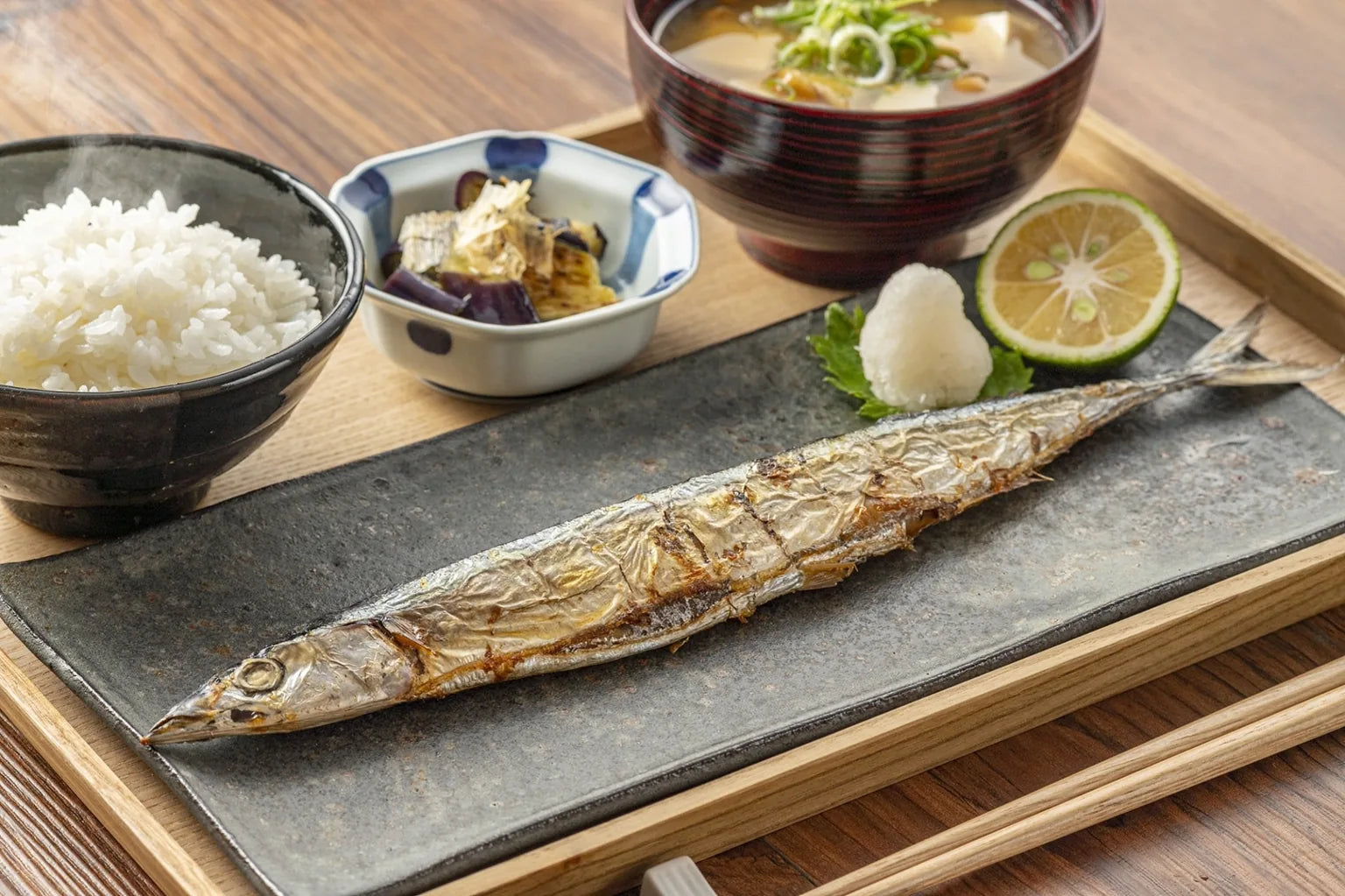 Traditional Japanese meal featuring grilled fish, rice and miso soup highlighting the importance of soft water