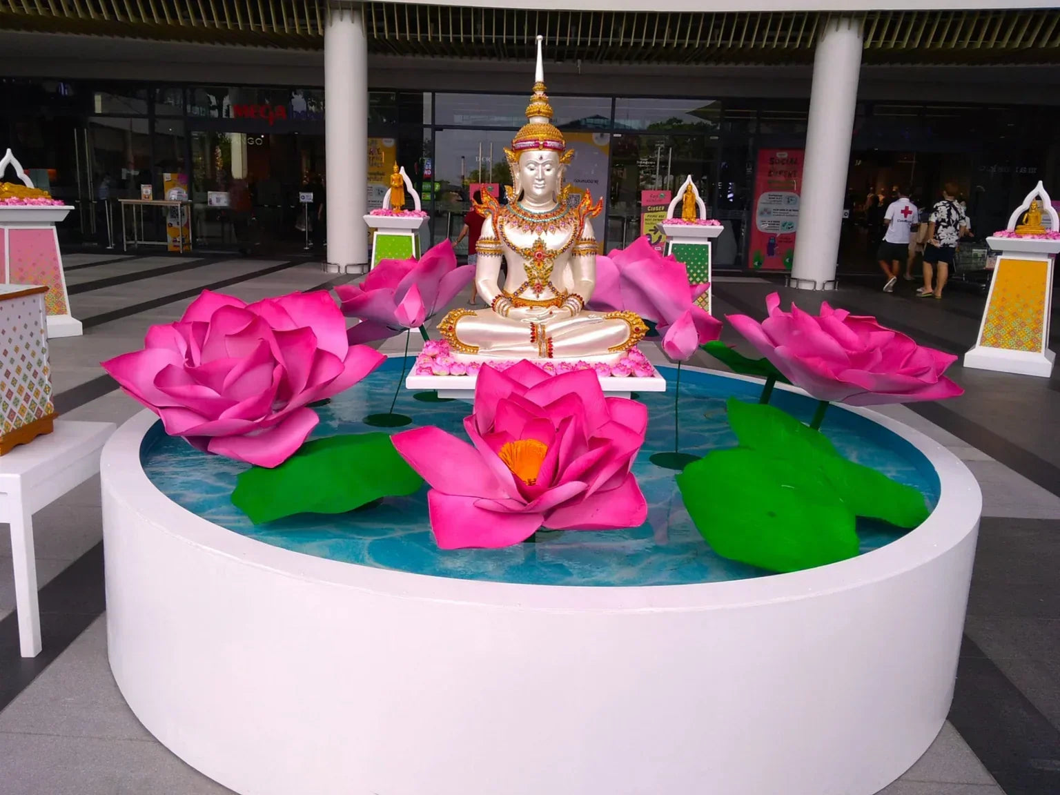 A lotus-themed water display with a seated Buddha statue, symbolizing purity, balance, and the calming relationship between water and inner wellness.
