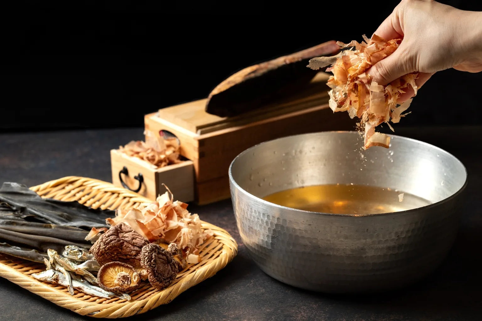 Traditional Japanese dashi ingredients including kombu kelp and bonito flakes