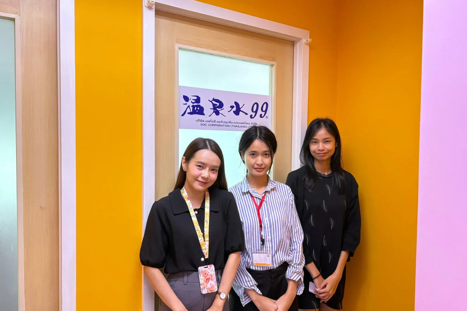 ONSENSUI99 Thailand team members standing in front of the SOC Corporation Thailand office entrance