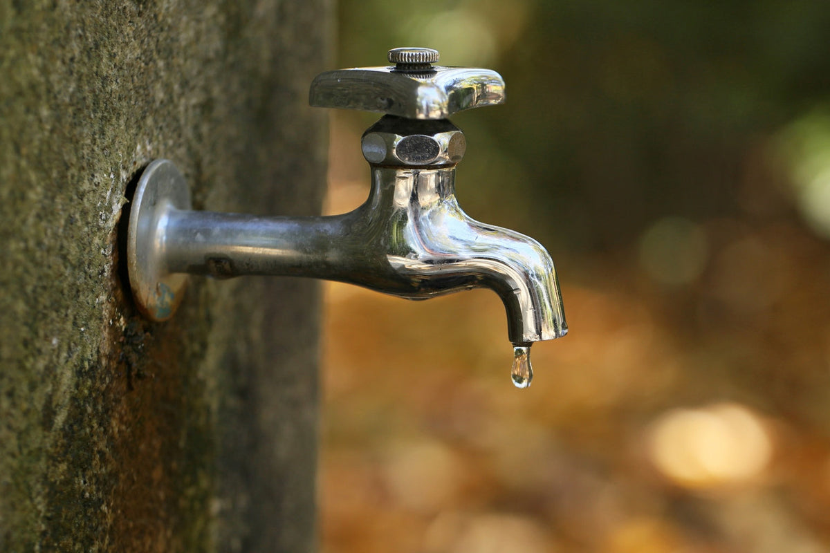 outdoor water tap dripping clean water