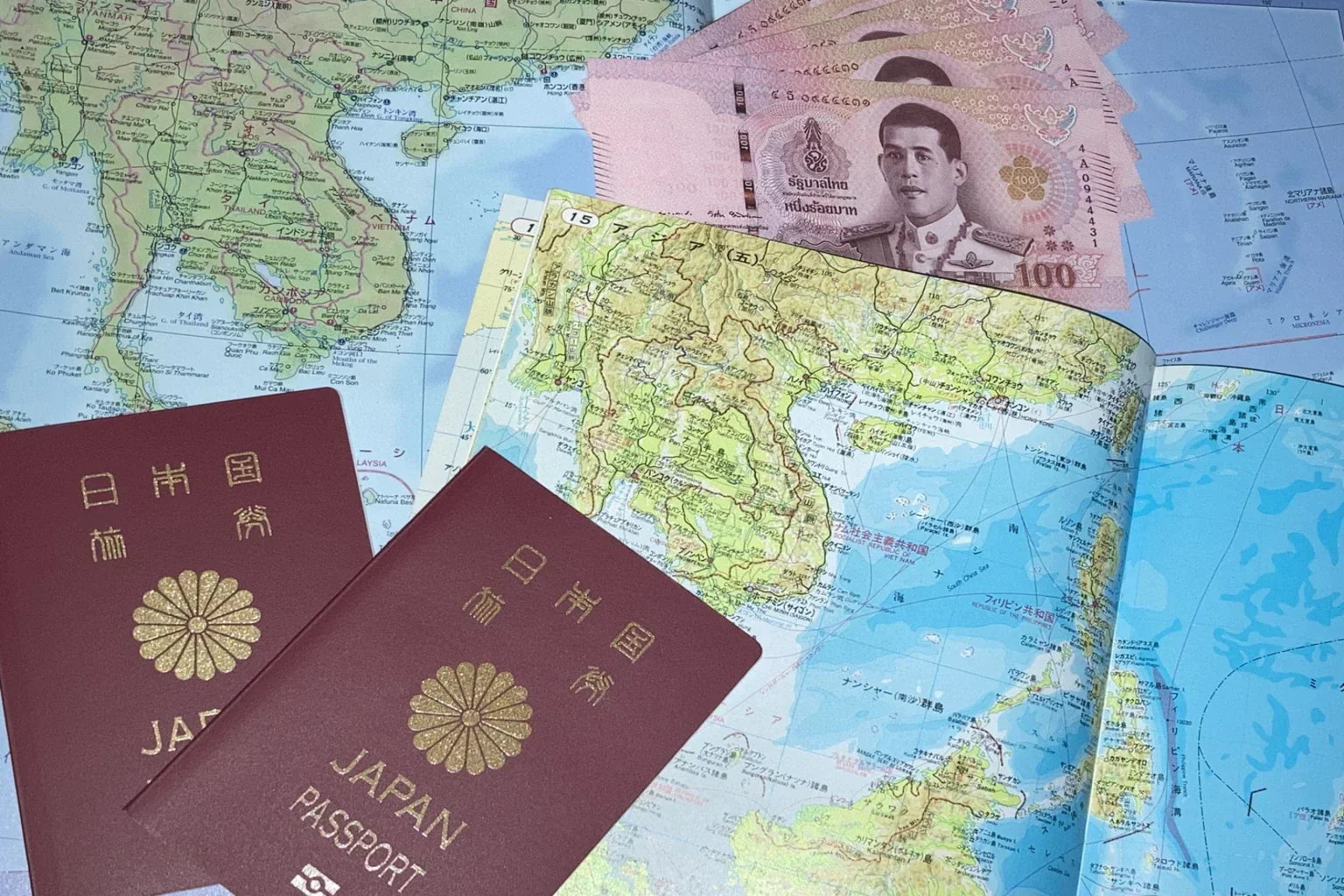 Thailand travel preparation with passport, map and local currency